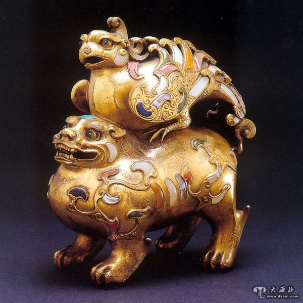 金飾器