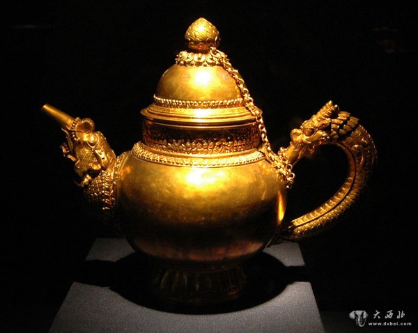 金飾器